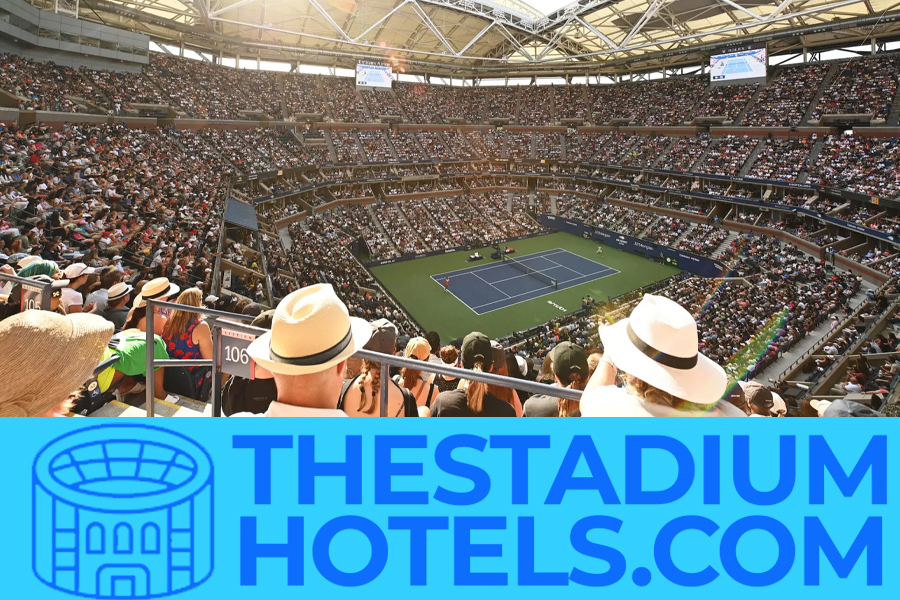 US Open tennis stadium at night with crowd and city lights